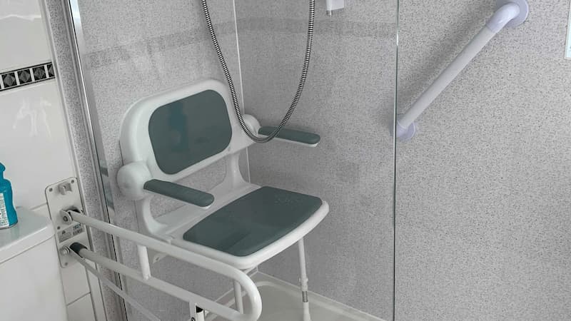 easily accessibly shower with folding shower seat