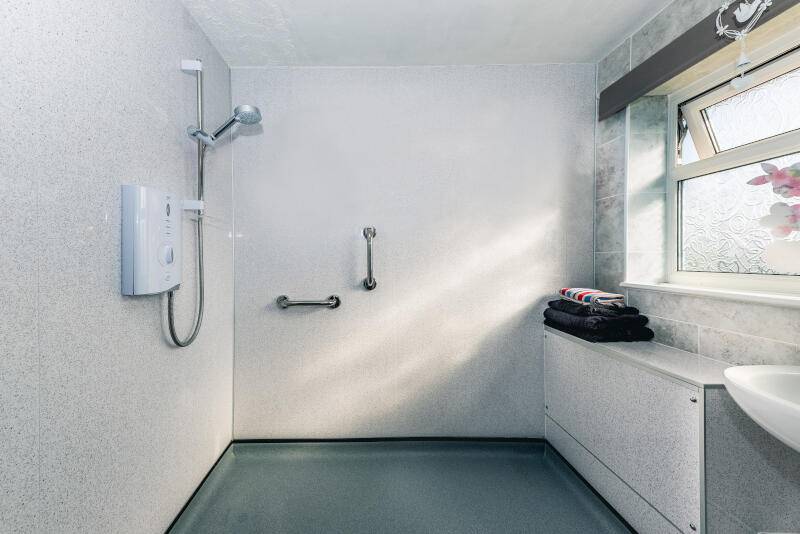 walk in shower-handles-assisted shower-white-tiles